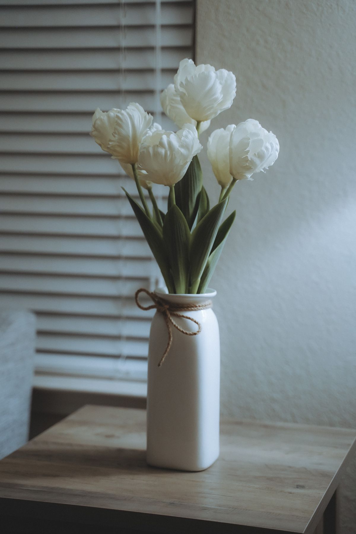 Bouquet of white lilies in a vase, a flower that is highly toxic to cats